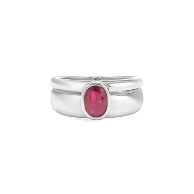 white gold ring with ruby center stone on white background