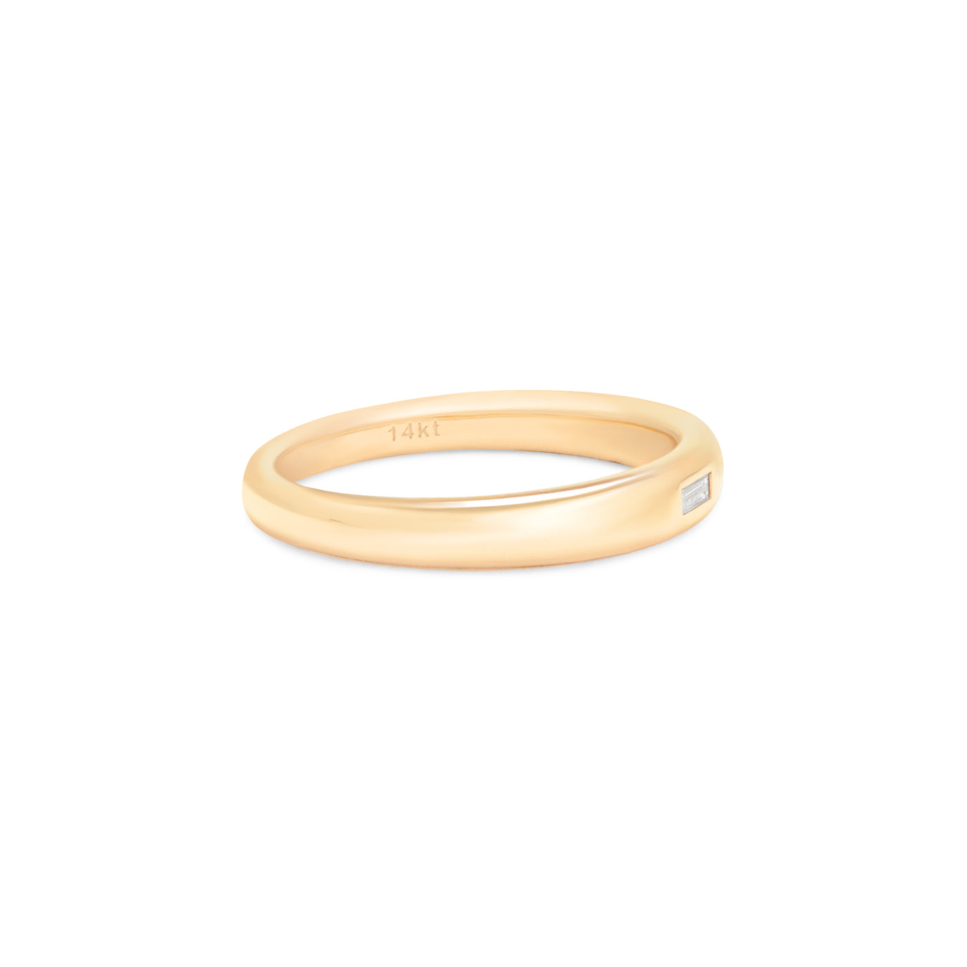 yellow gold ring with baguette diamond center stone on white background