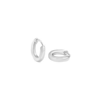 White gold hoops on white background