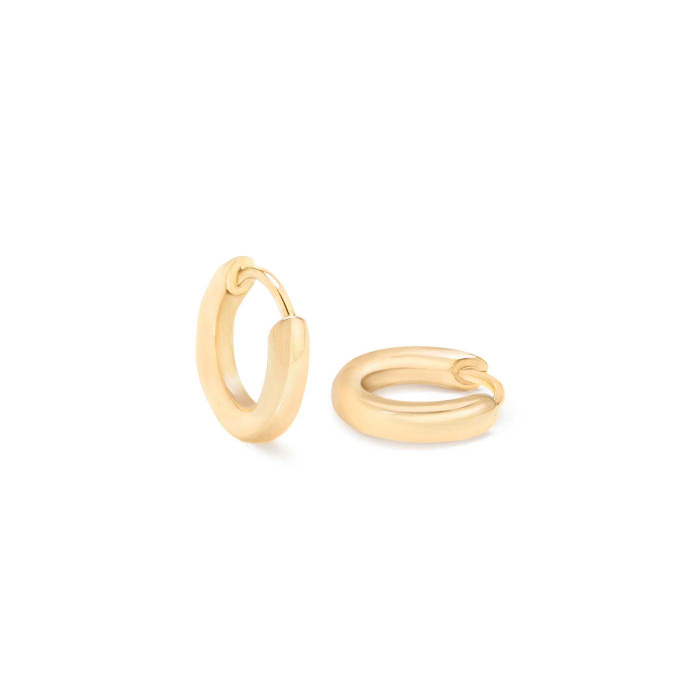 yellow gold hoops on white background
