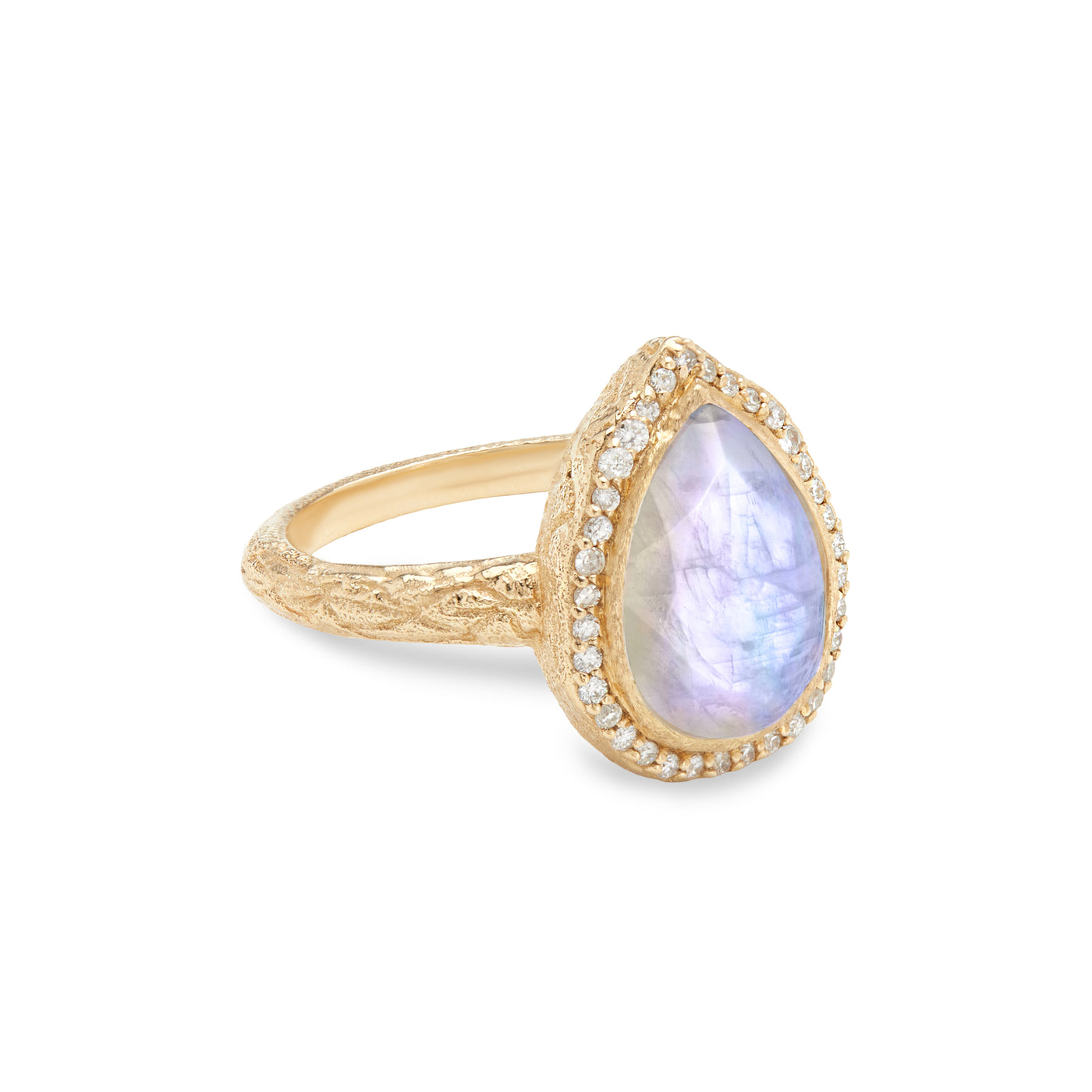 14 Karat Yellow Gold Ring with Pear Shaped Moonstone Stone with Halo of White Diamonds Against White Background Turned for Side View