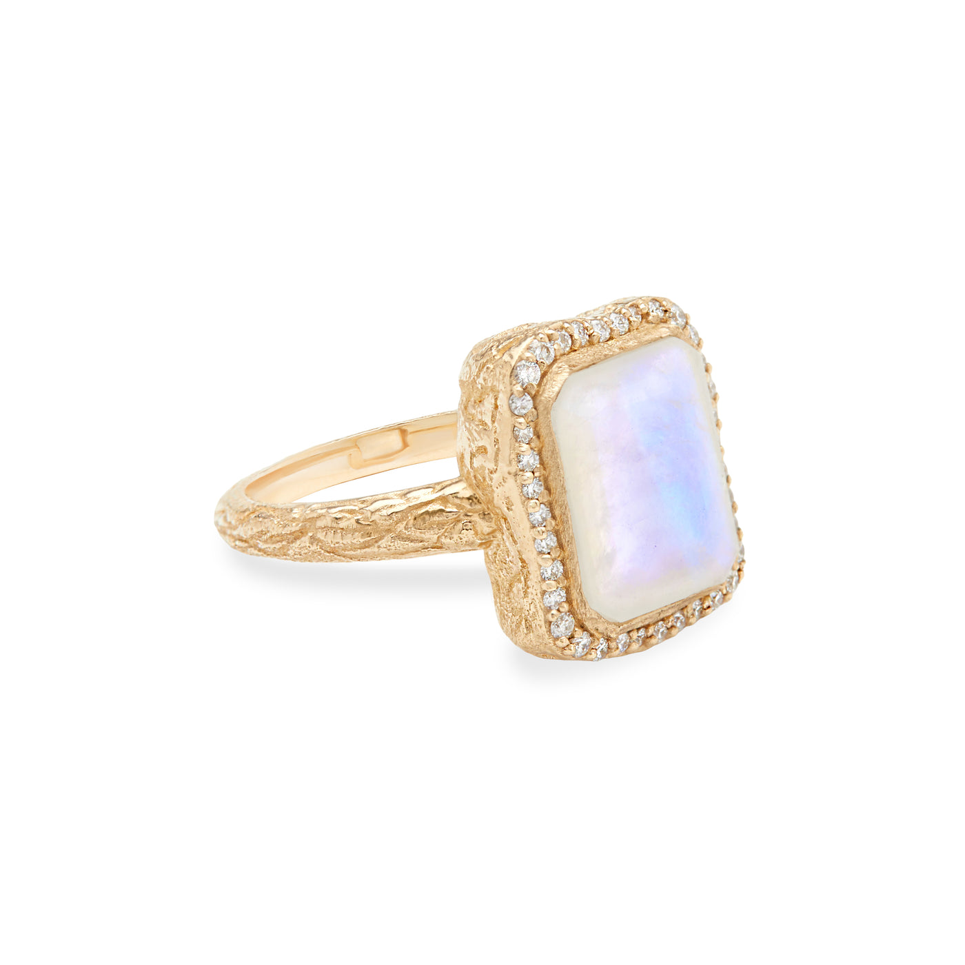 14 Karat Yellow Gold Ring with Rectangle Shaped Moonstone with Halo of White Diamonds Against White Background Turned to Side