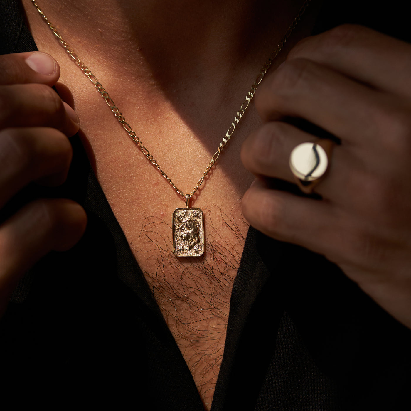 mens yellow gold bengal tiger pendant on figaro chain on model