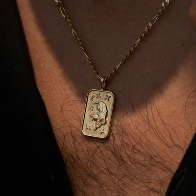 mens yellow gold bengal tiger pendant on figaro chain on model