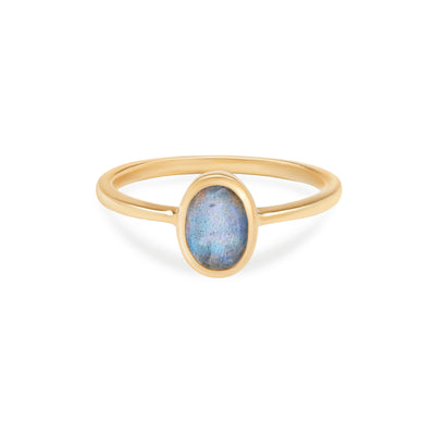  14 Karat Yellow Gold Ring with Oval Shaped Labradorite Stone Against White Background