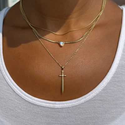 Sword Pendant work on model layered with other necklaces