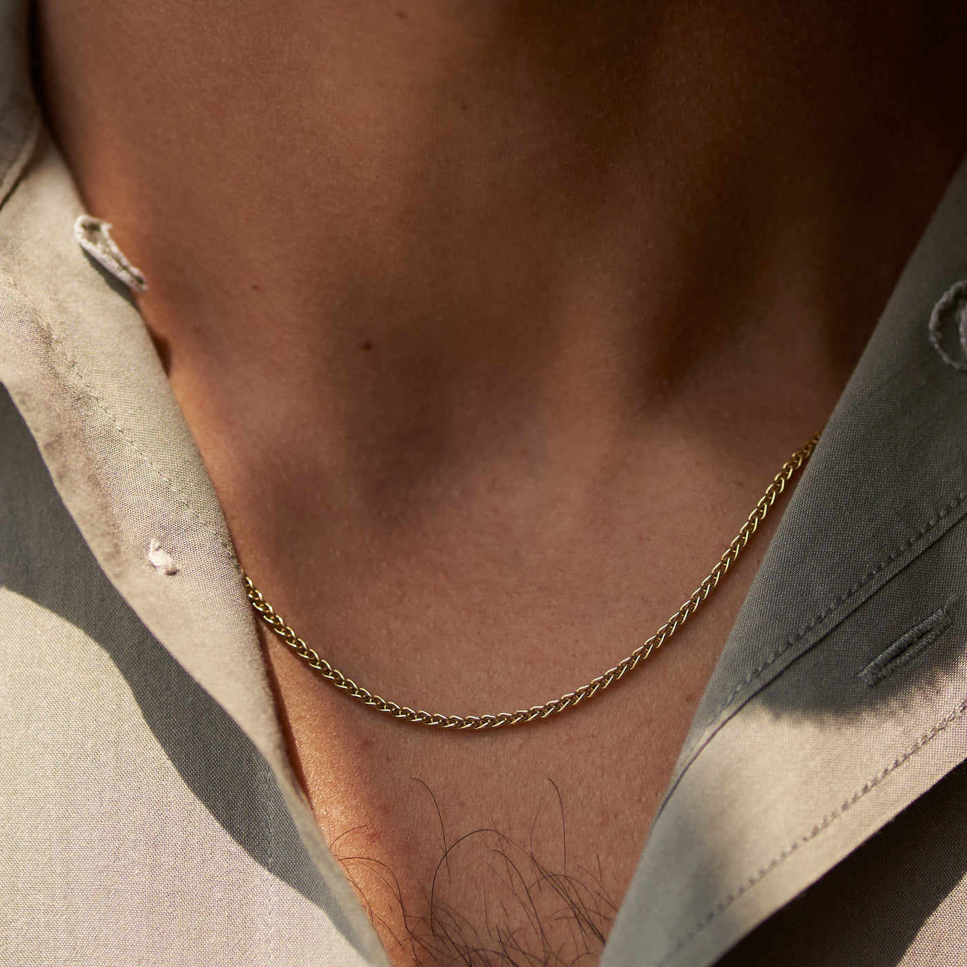 Yellow gold men’s wheat chain on model