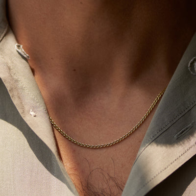 Yellow gold men’s wheat chain on model