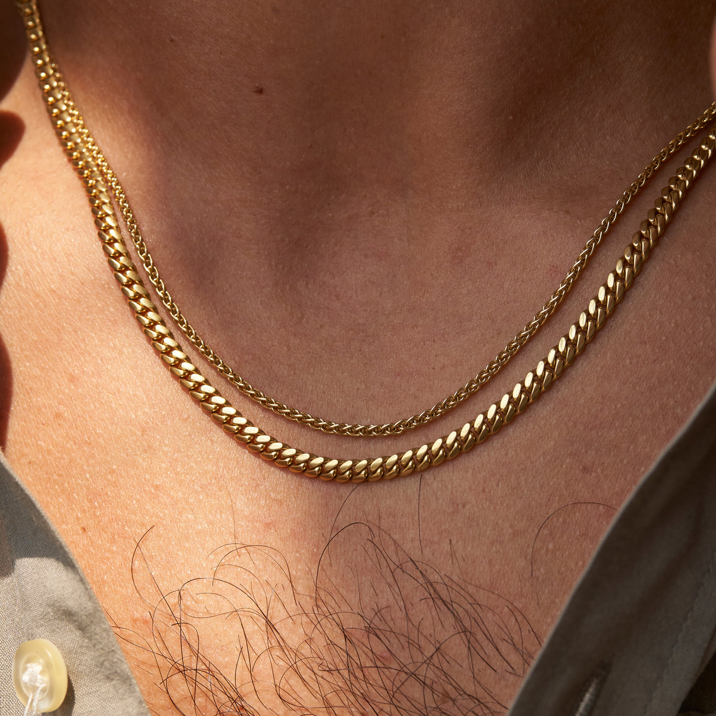 yellow gold mens wheat chain and Cuban chain on model